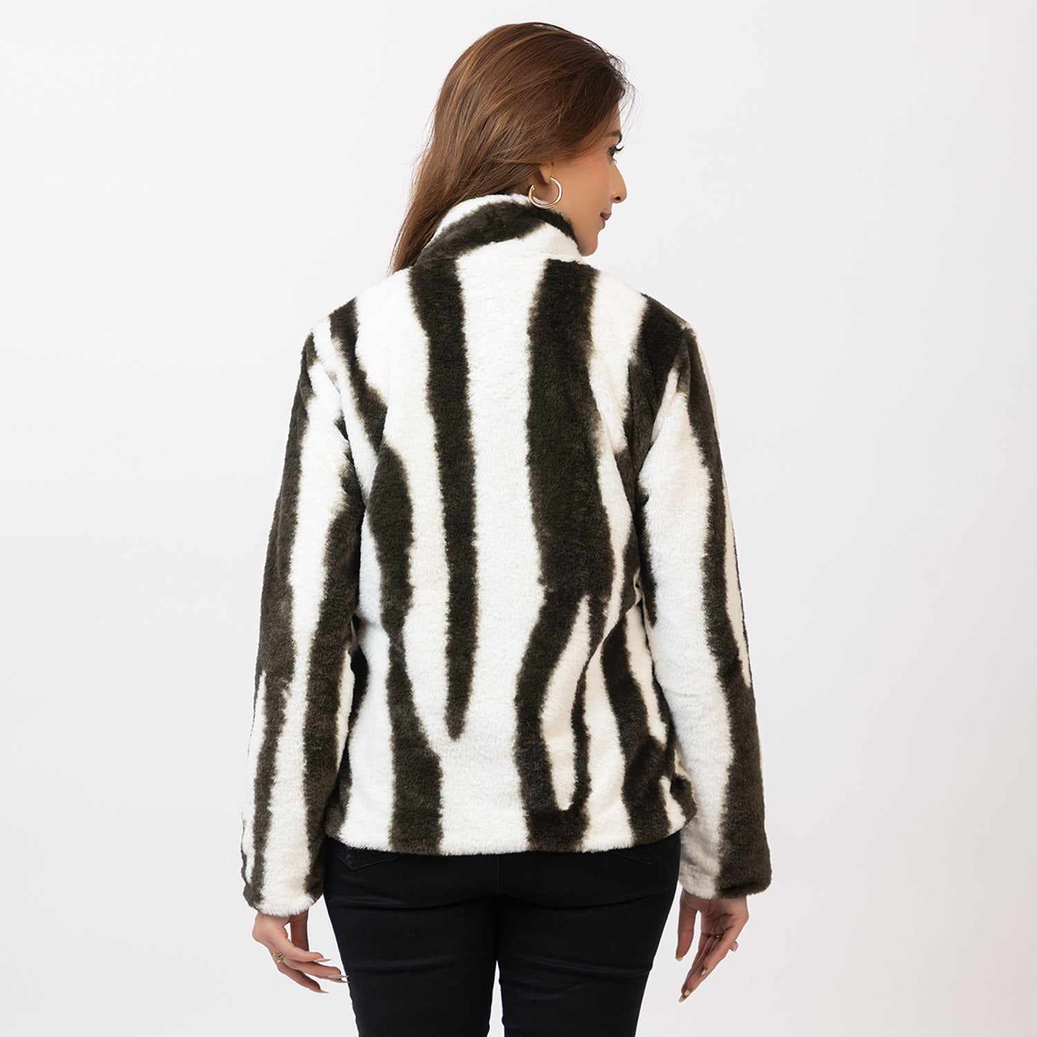 Woman wearing a zebra-striped jacket on a white background Amoldo

