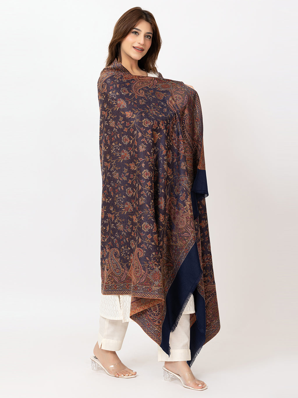  Amoldo Woman wearing a patterned shawl over a plain background