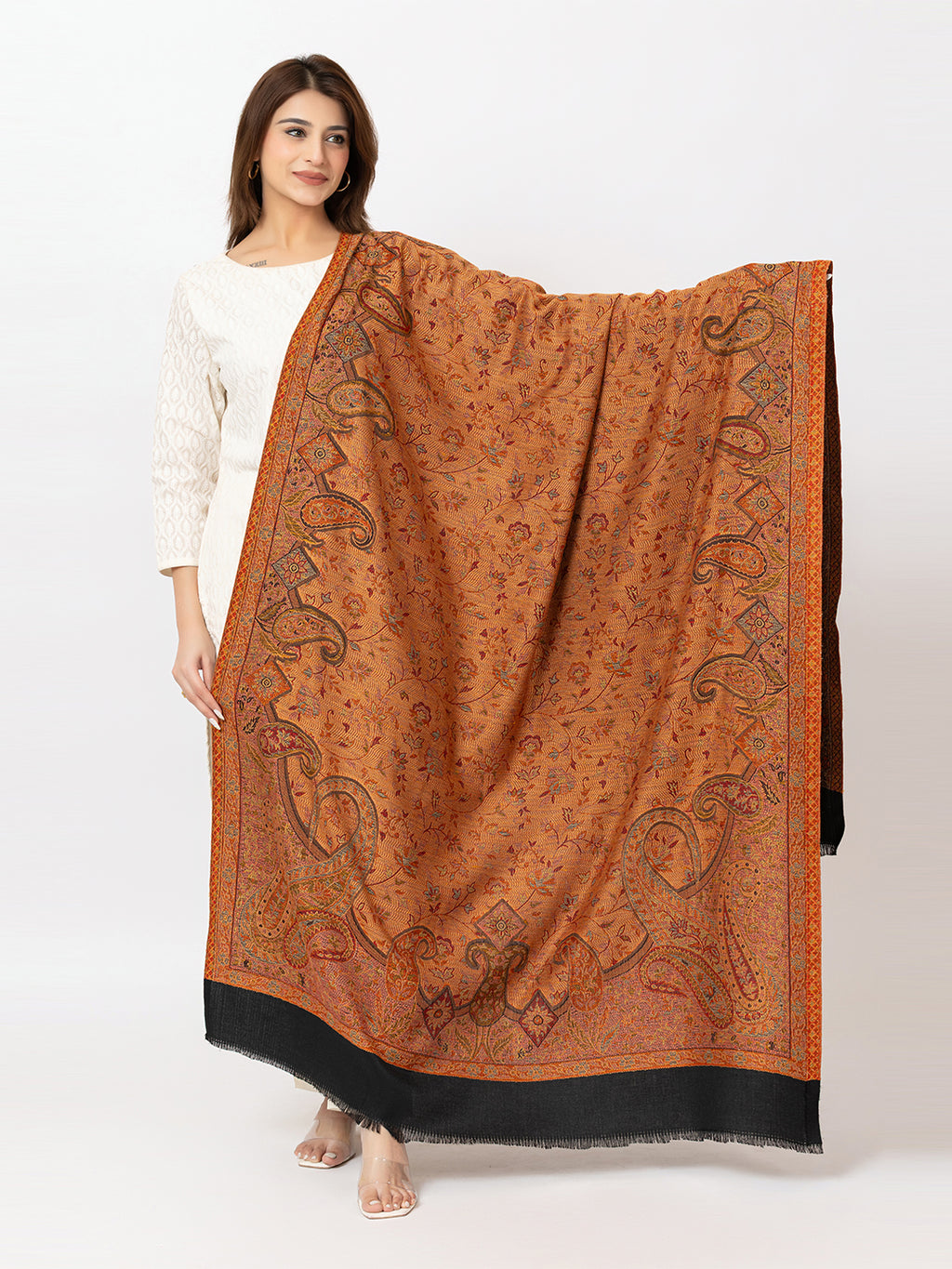 Amoldo Woman holding a large orange patterned scarf on a white background