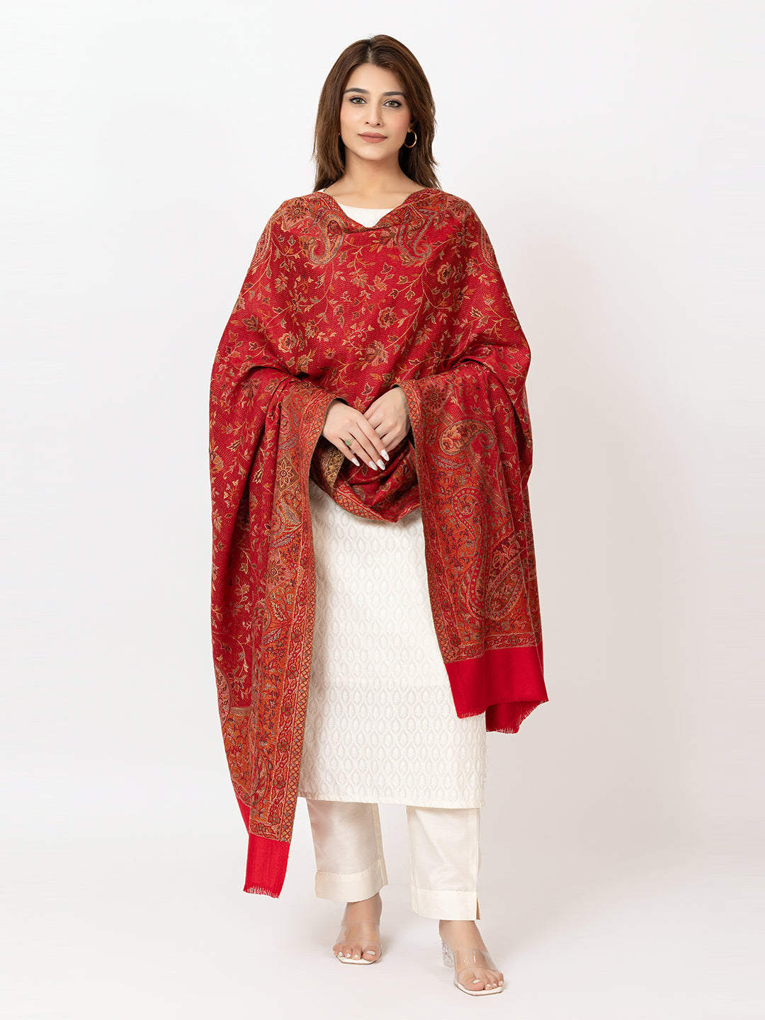 Amoldo  Woman wearing a red patterned shawl over a white outfit on a white background