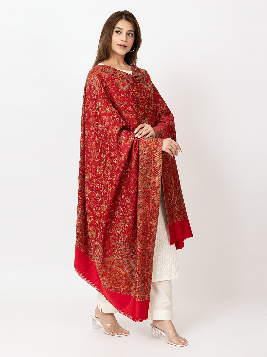 Amoldo  Woman wearing a red patterned dupatta over a white outfit on a white background