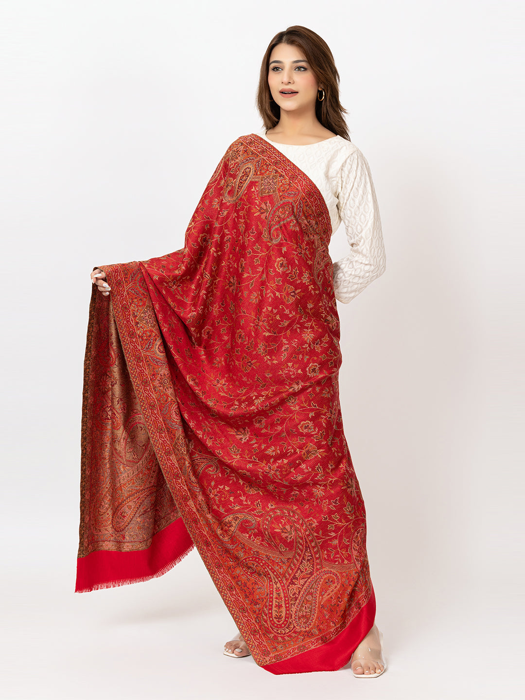 Amoldo Woman holding a red patterned scarf against a white background