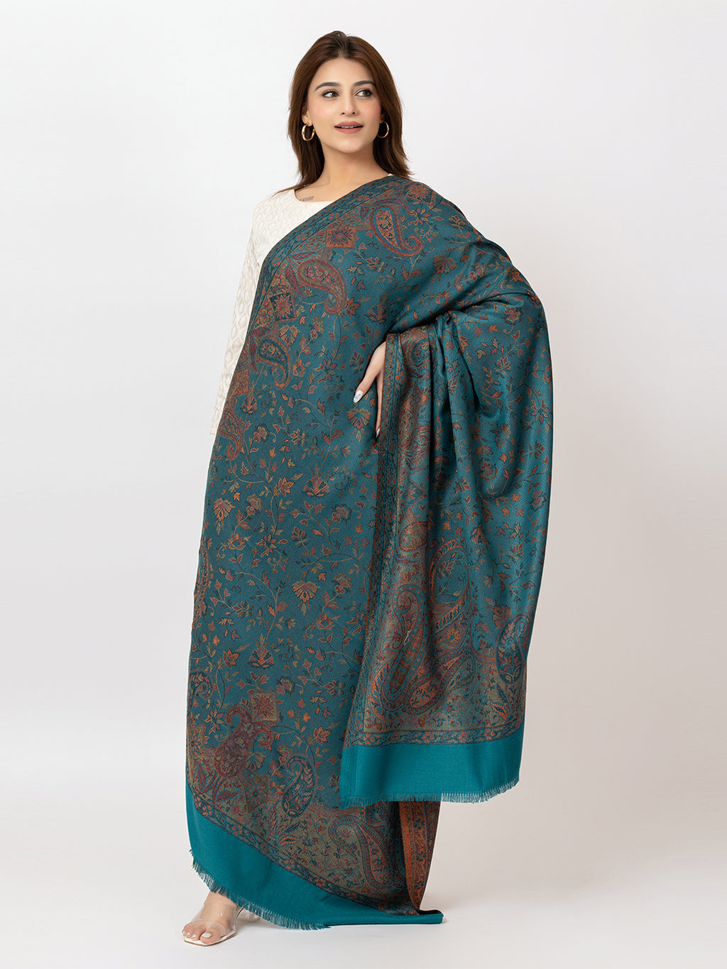   Amoldo  Woman wearing a teal patterned scarf on a white background