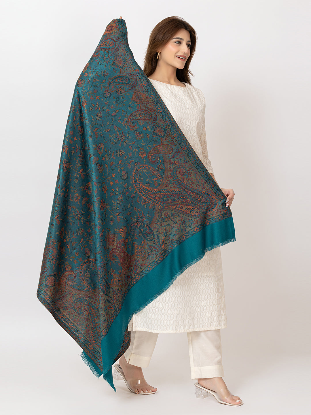  Amoldo  Woman holding a teal patterned scarf against a white background